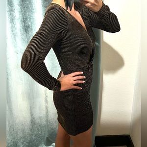 Marciano long sleeve black and gold dress, wrap front neckline.